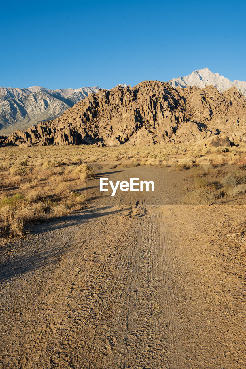 Scenic view of desert against clear sky