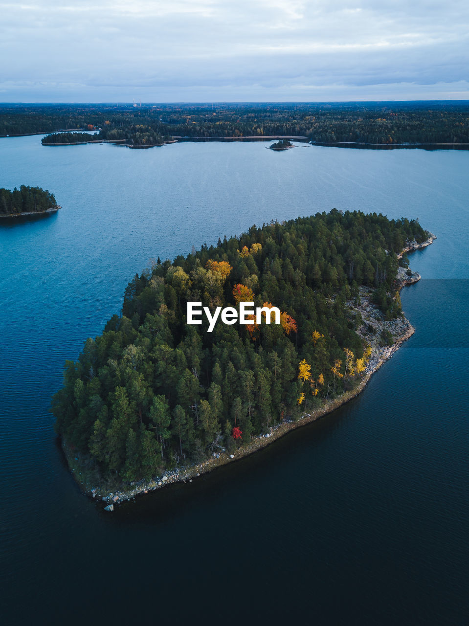 High angle view of island amidst sea against sky