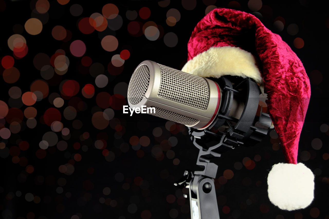 Close-up of santa hat on microphone against defocused background