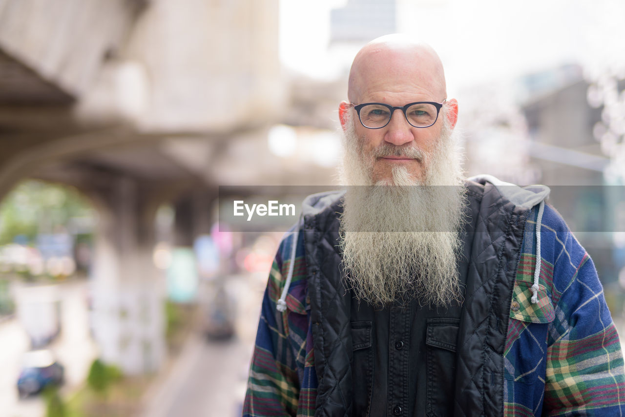 Portrait of man standing outdoors