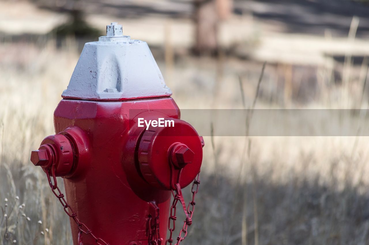 Close up of red fire hydrant against blurred background