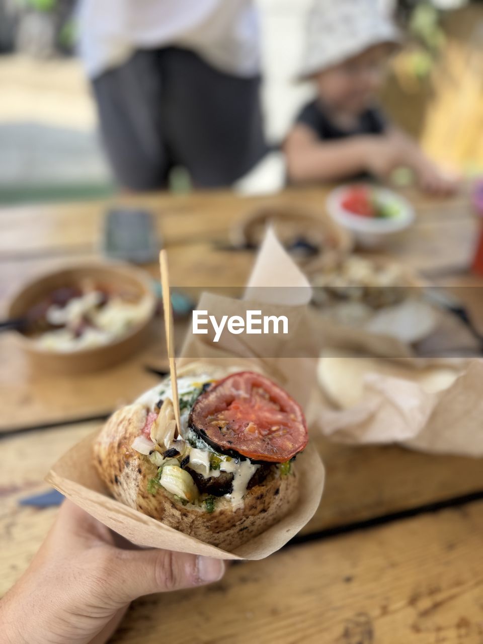 cropped hand of man holding food