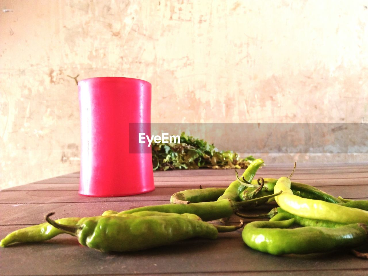CLOSE-UP OF VEGETABLES AND GREEN TABLE