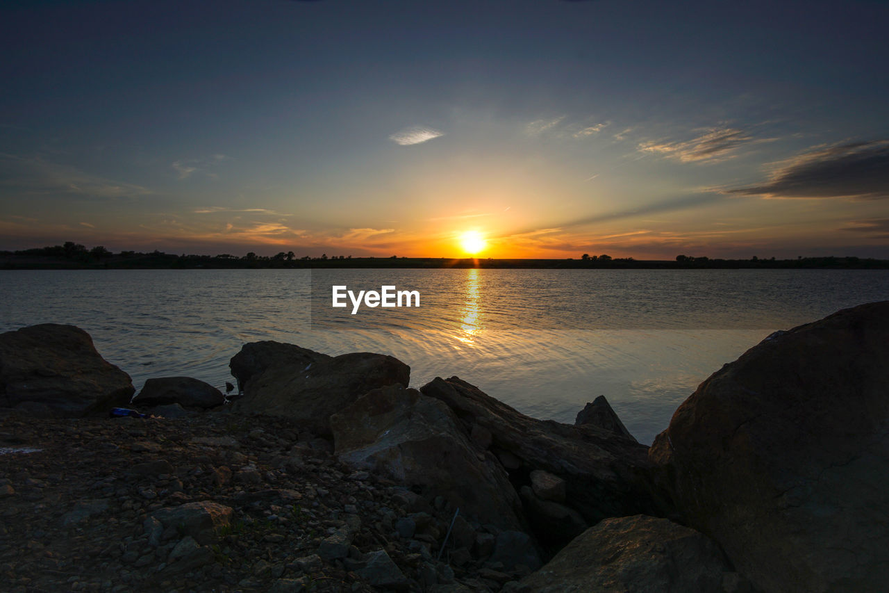 Scenic view of sea against sky during sunset