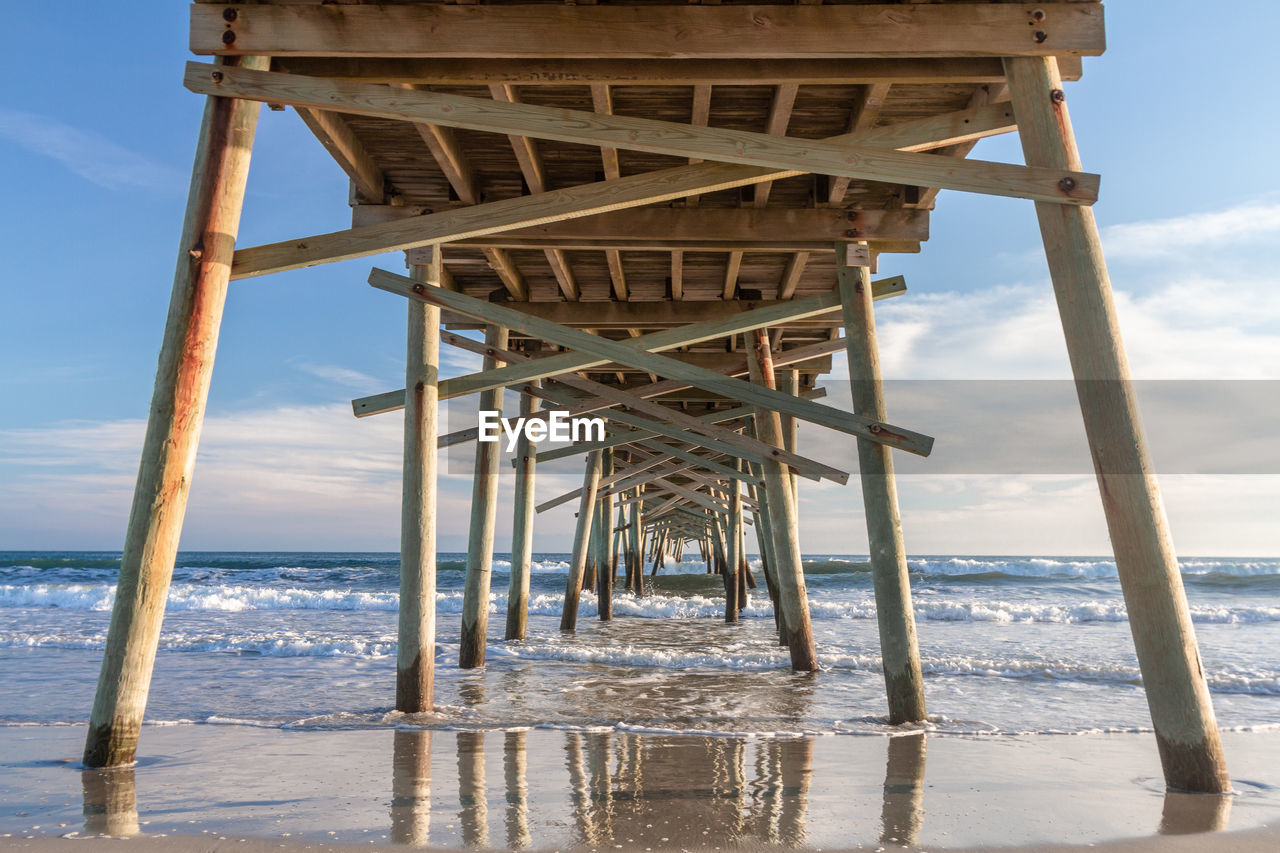 Pier over sea against sky