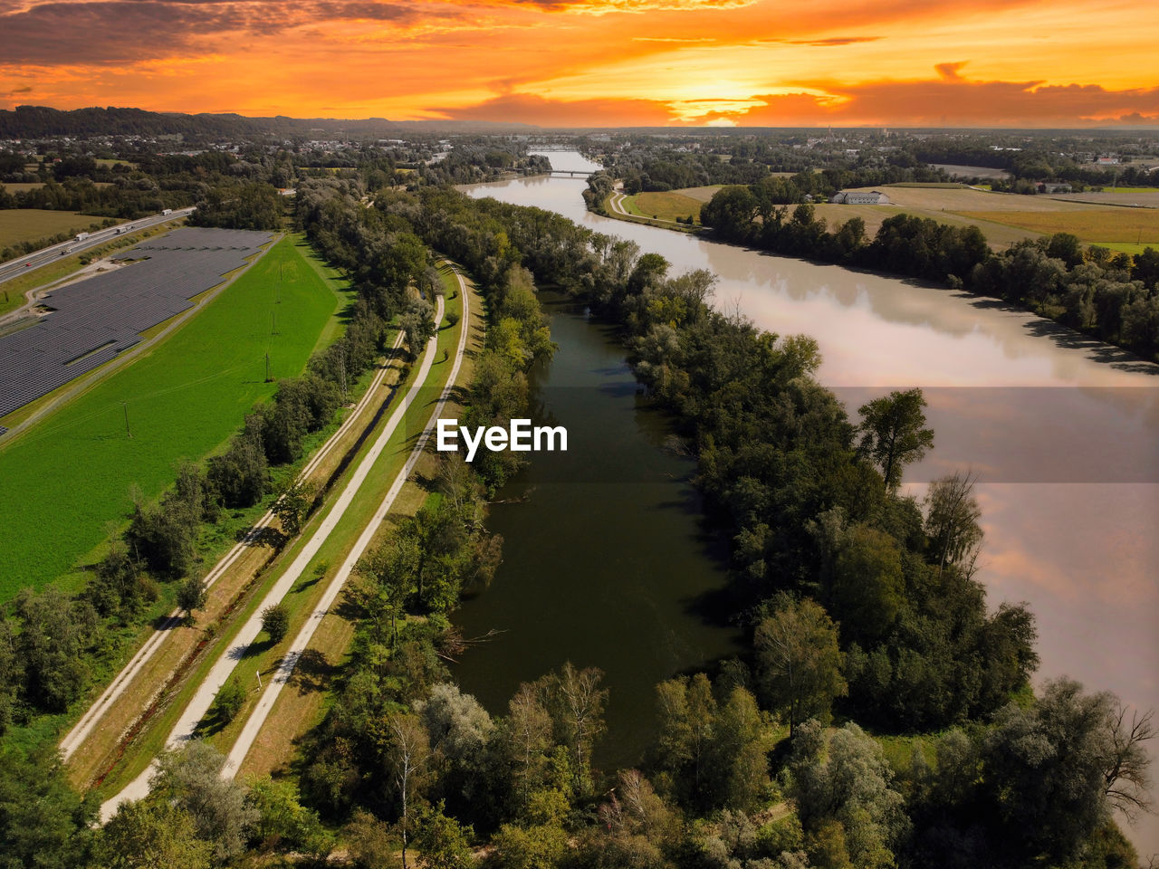 high angle view of road by river against sky during sunset