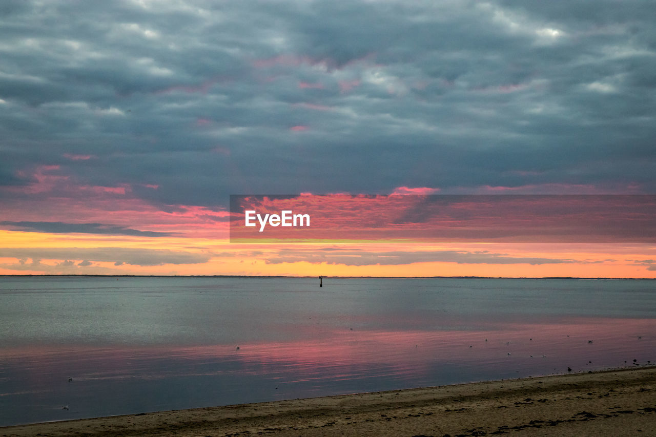 View of calm sea at sunset