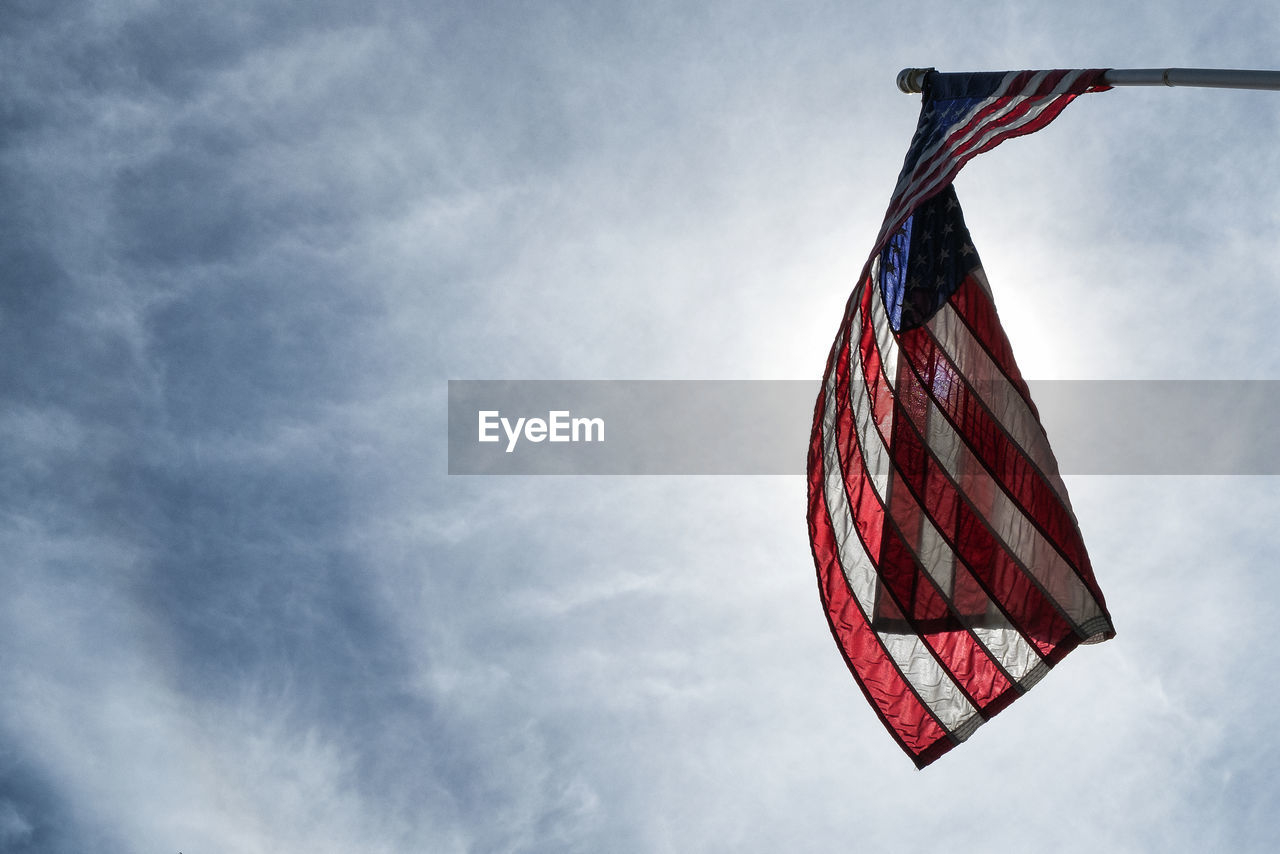 Low angle view of flag against sky