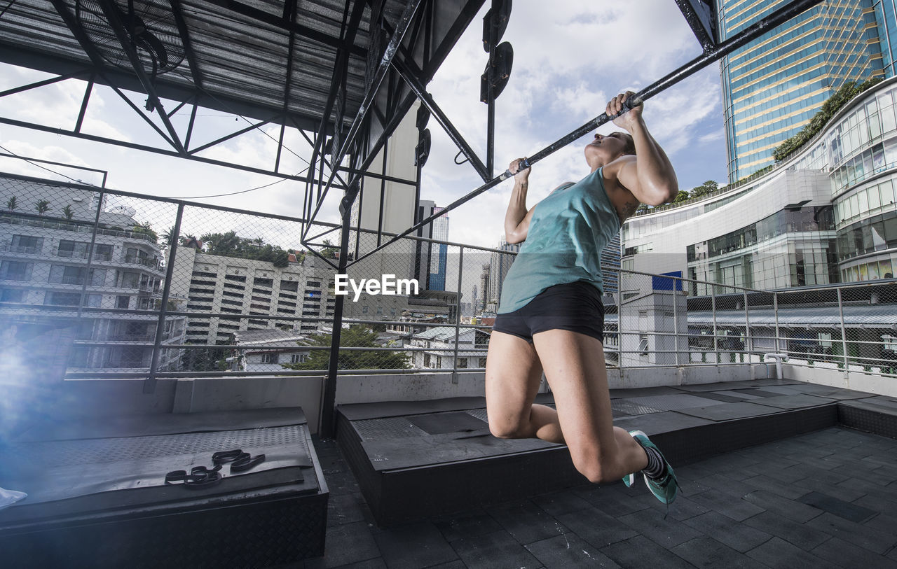 Woman training at rooftop gym in bangkok