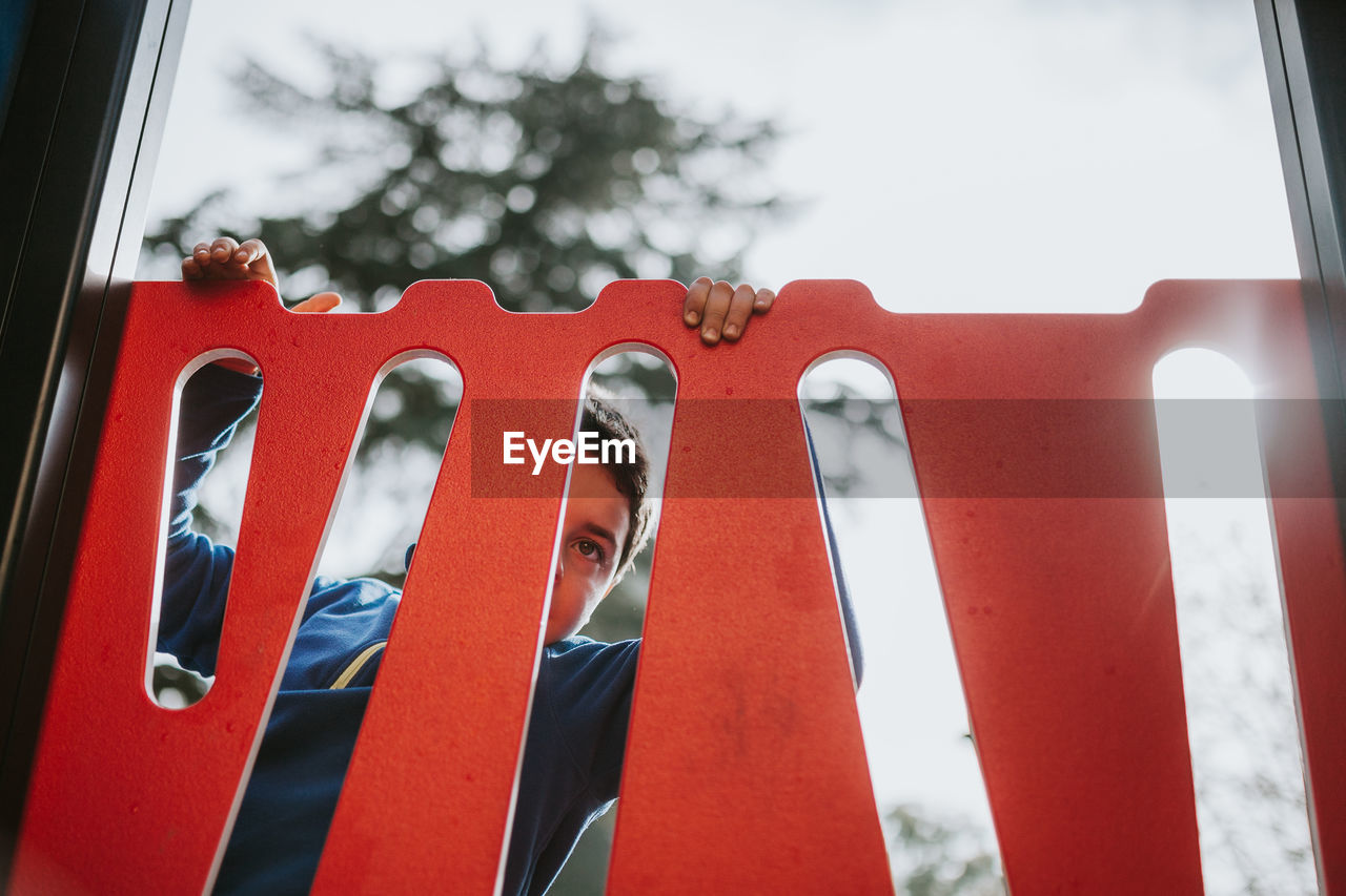 Boy at outdoor play equipment