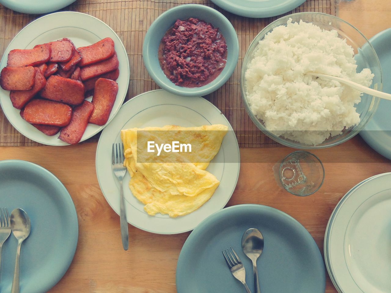 Directly above shot of rice with omelet on dining table