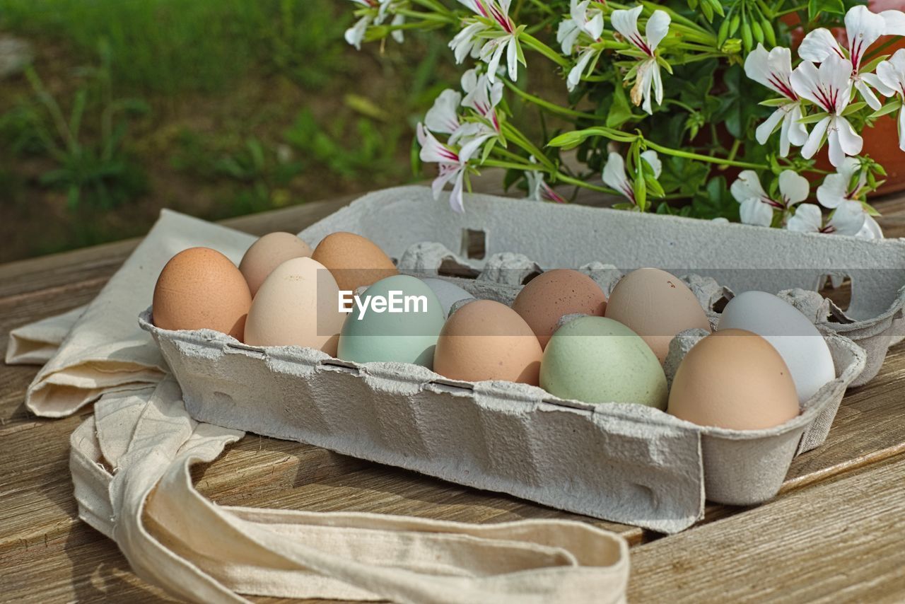 Close-up of eggs in basket on table