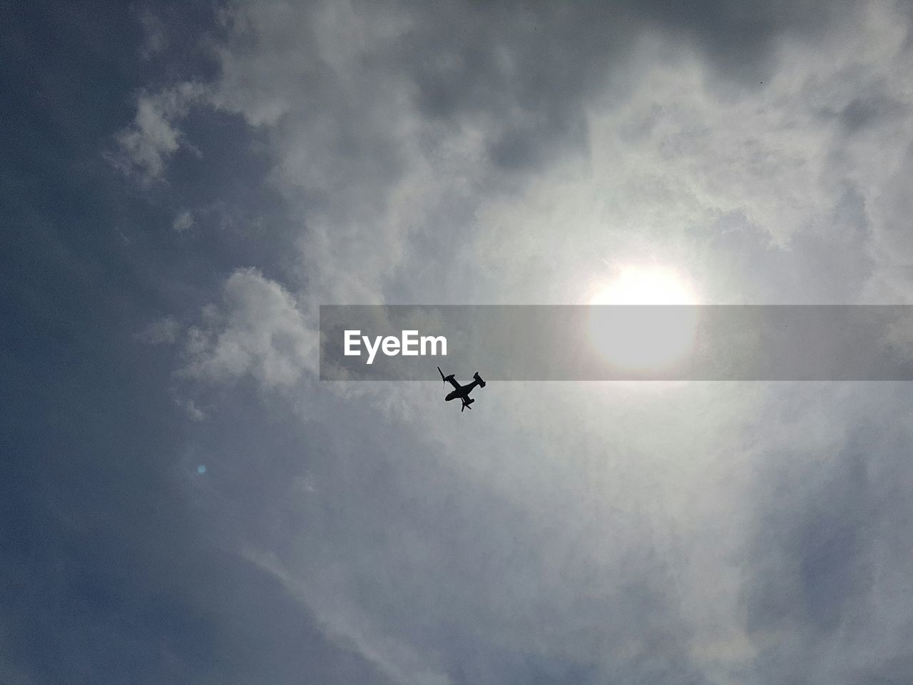 Low angle view of airplane flying in sky