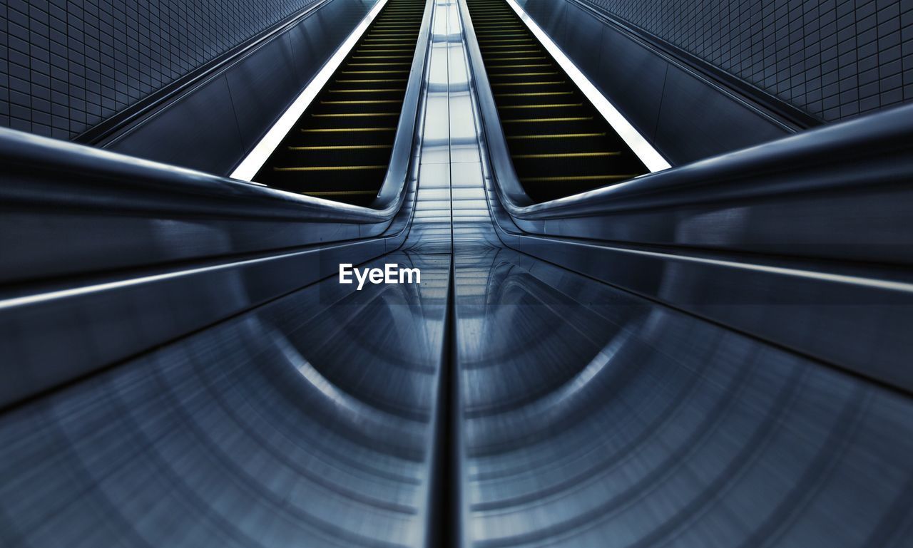 Low angle view of empty escalator at subway