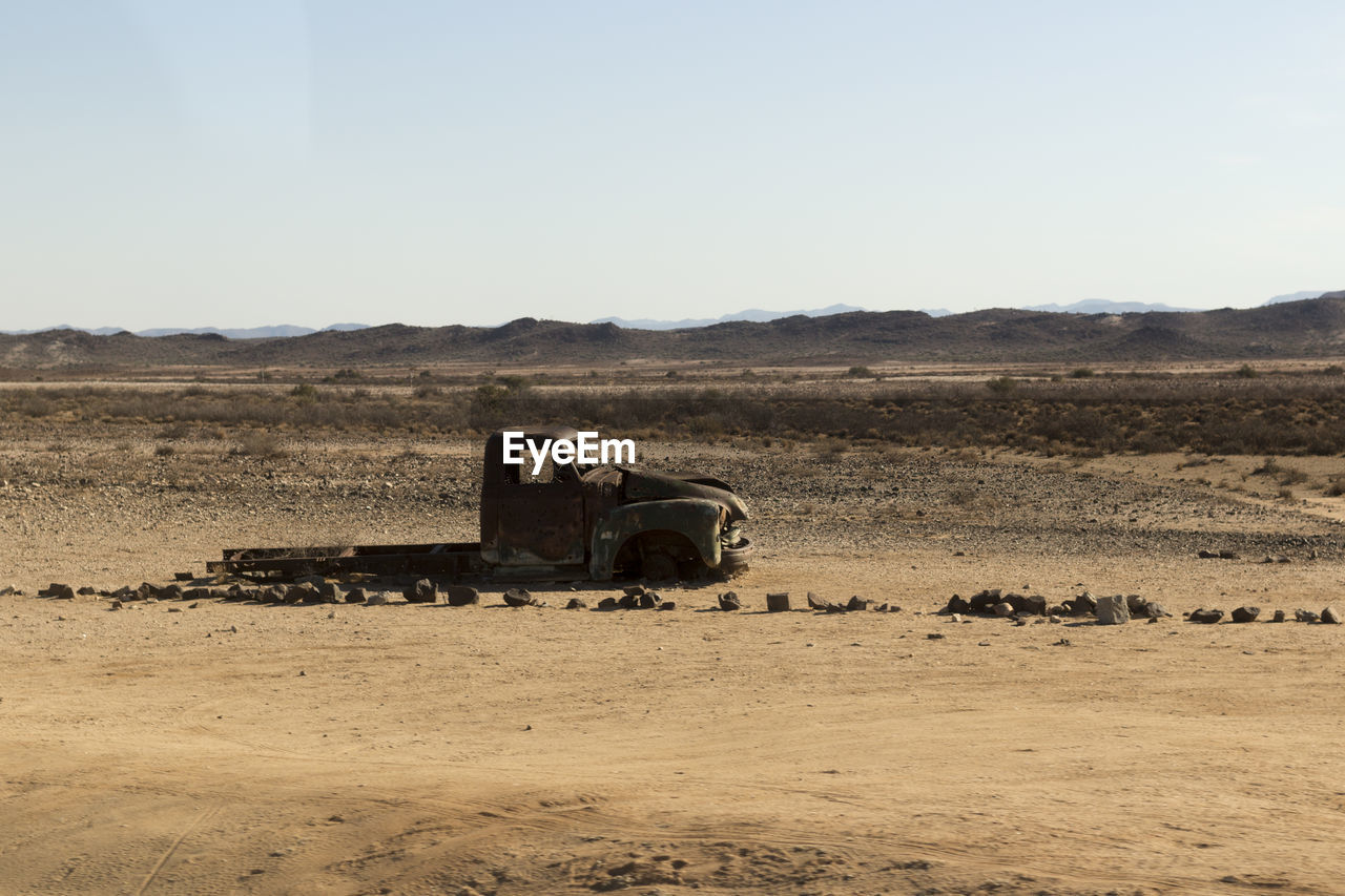 Scenic view of desert against clear sky