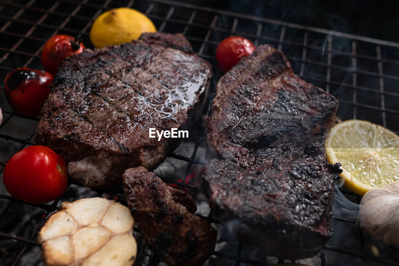 HIGH ANGLE VIEW OF FRUITS ON BARBECUE