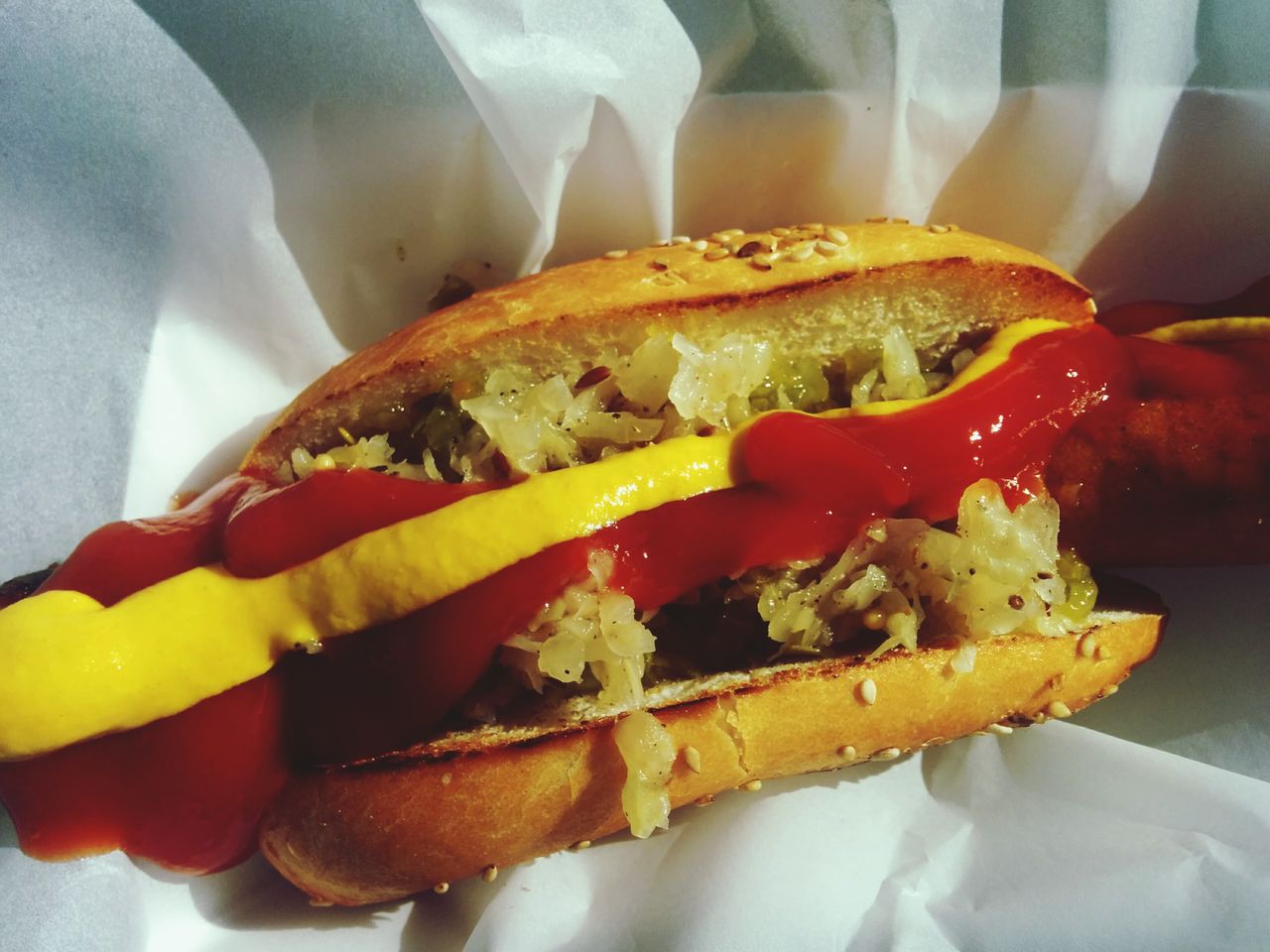 Close-up of hot dog with ketchup and mustard