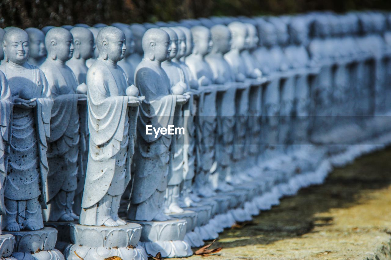 Close-up of stack of statues 