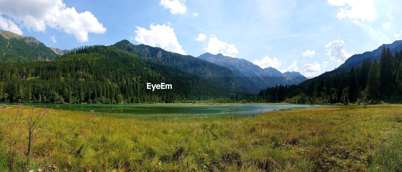 Panoramic view of lake and mountains against sky