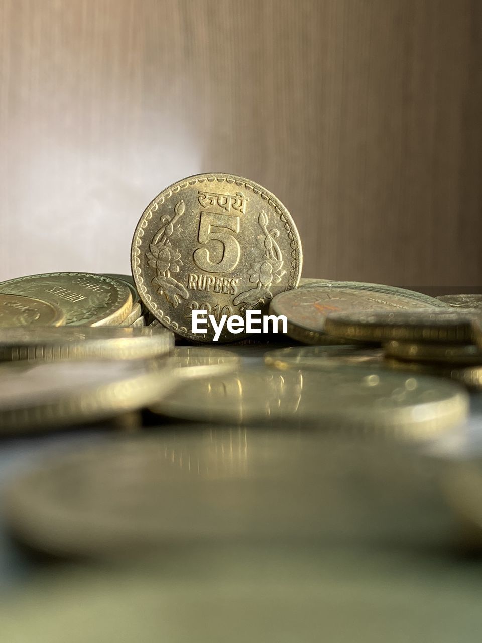 Close-up of coins on table