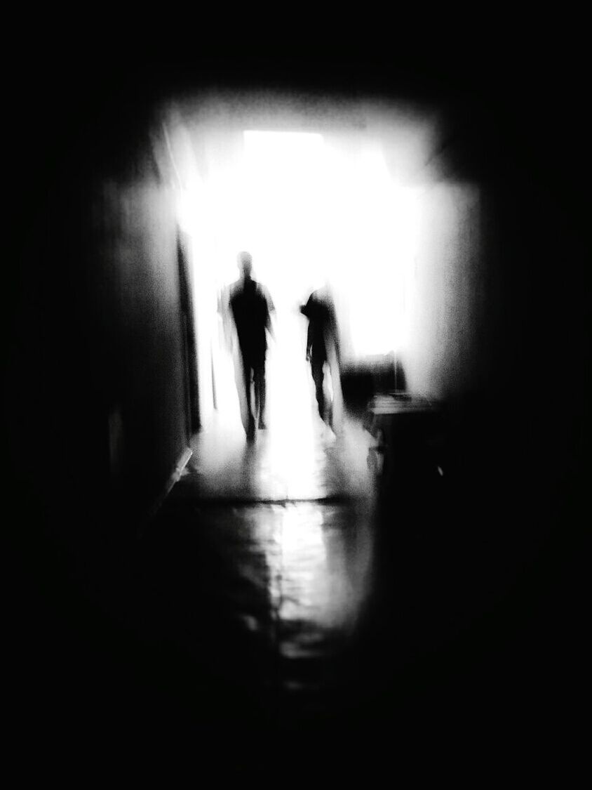 SILHOUETTE OF WOMAN IN TUNNEL
