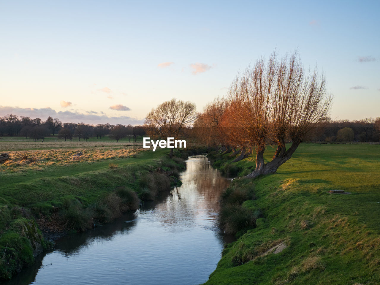 Sunset over beverly brook in richmond park