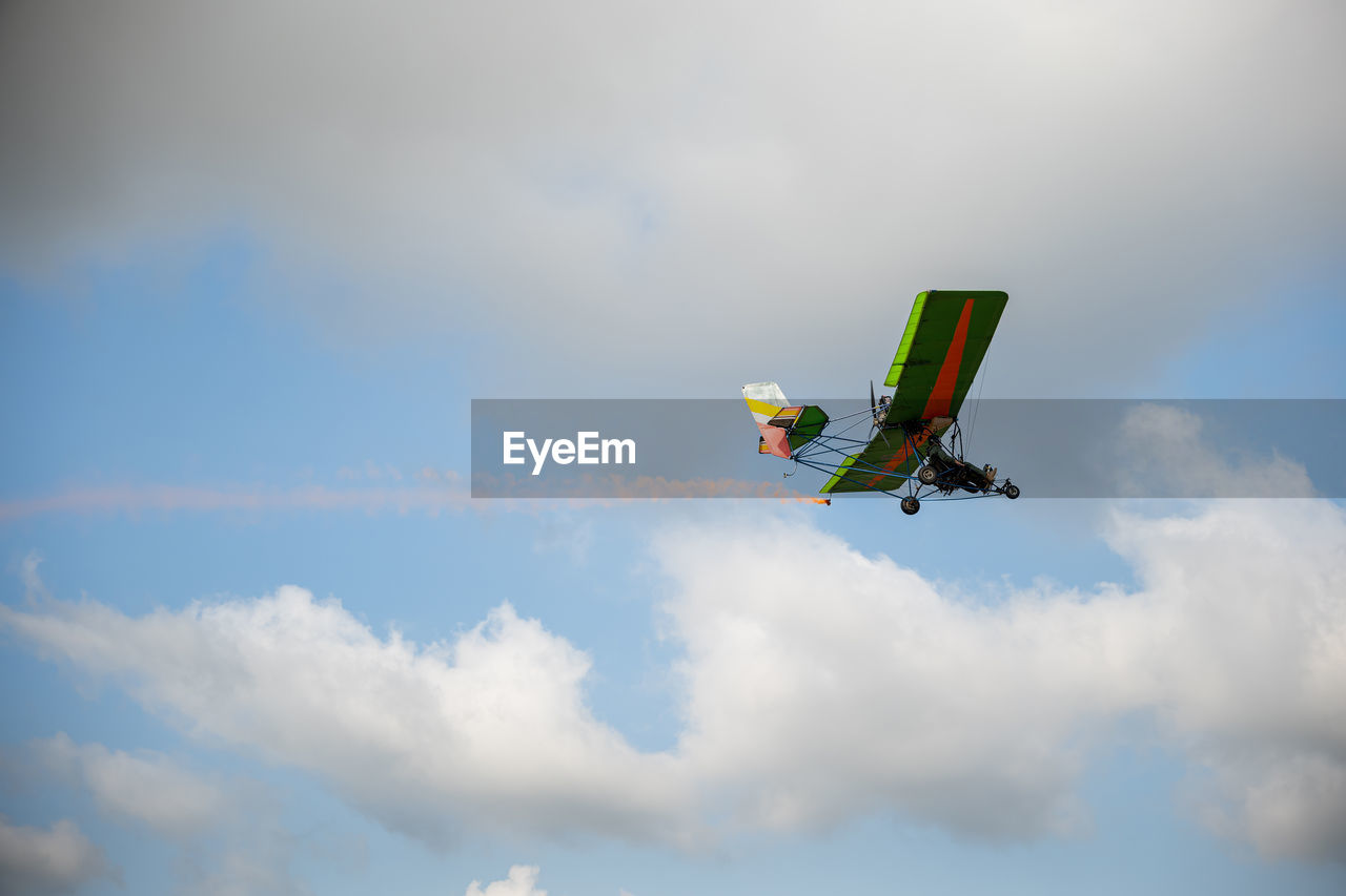 low angle view of airplane wing against sky