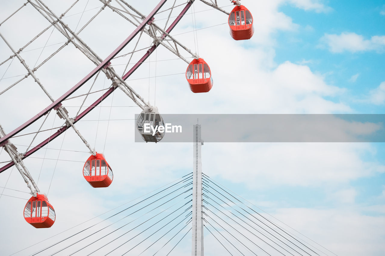 LOW ANGLE VIEW OF RED LANTERN HANGING AGAINST SKY