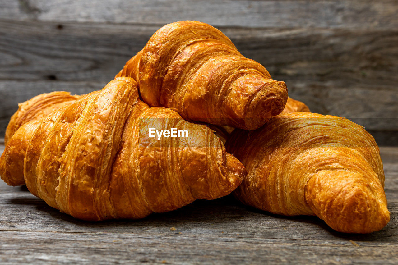 croissant, food and drink, food, viennoiserie, french food, baked, freshness, still life, table, brown, fast food, no people, produce, close-up, dessert, wood, bread, pastry, indoors, baked pastry item