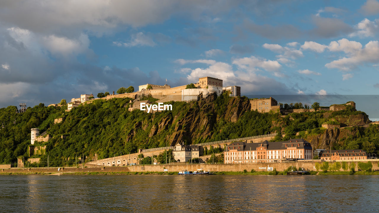 Panoramic view of the ehrenbreitstein fortress on the side of river rhine in koblenz, germany.