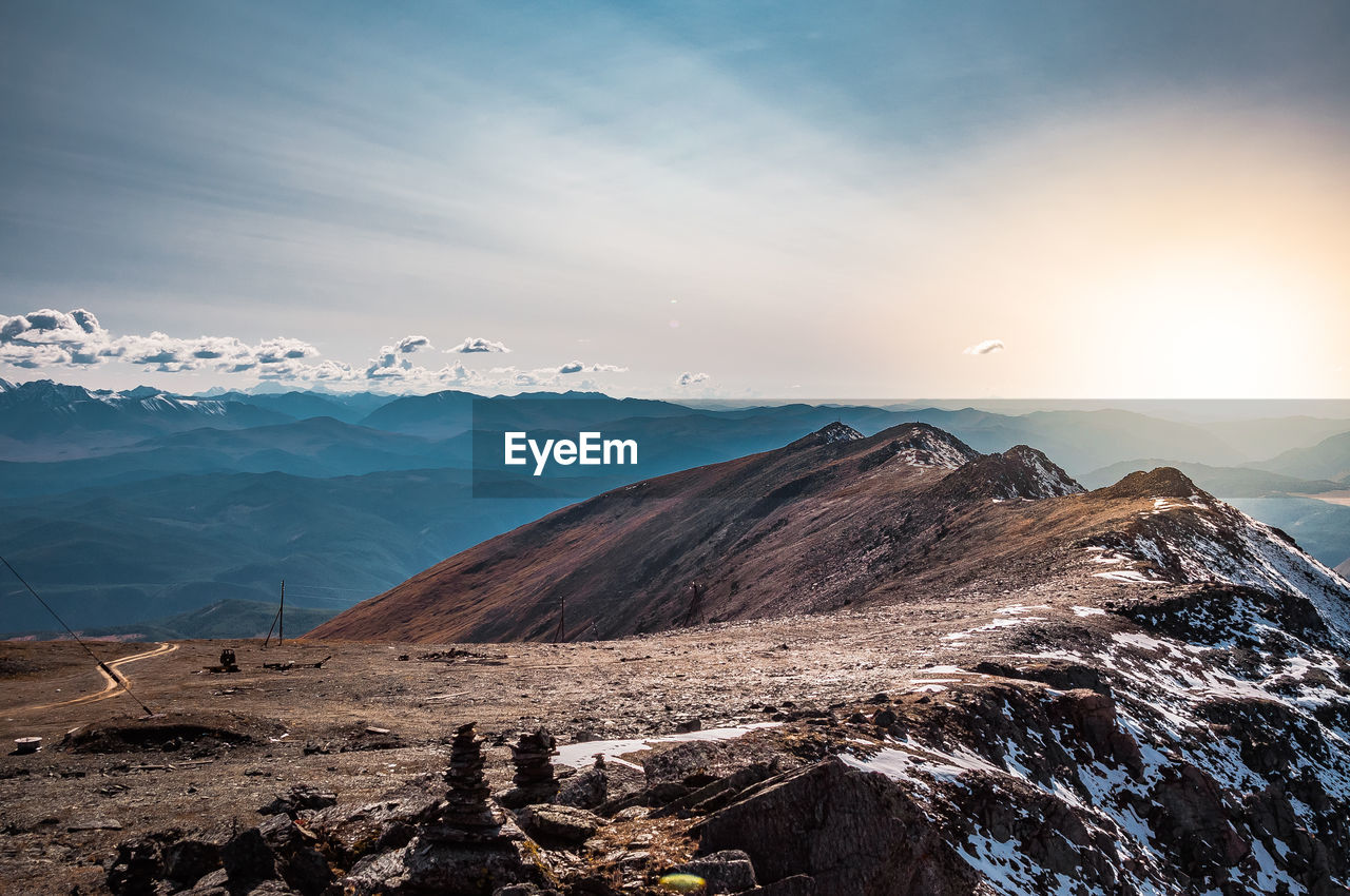 Scenic view of snowcapped mountains against sky