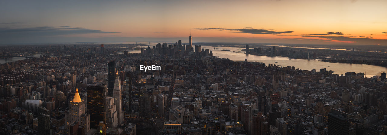 Panoramic view of buildings against sky during sunset