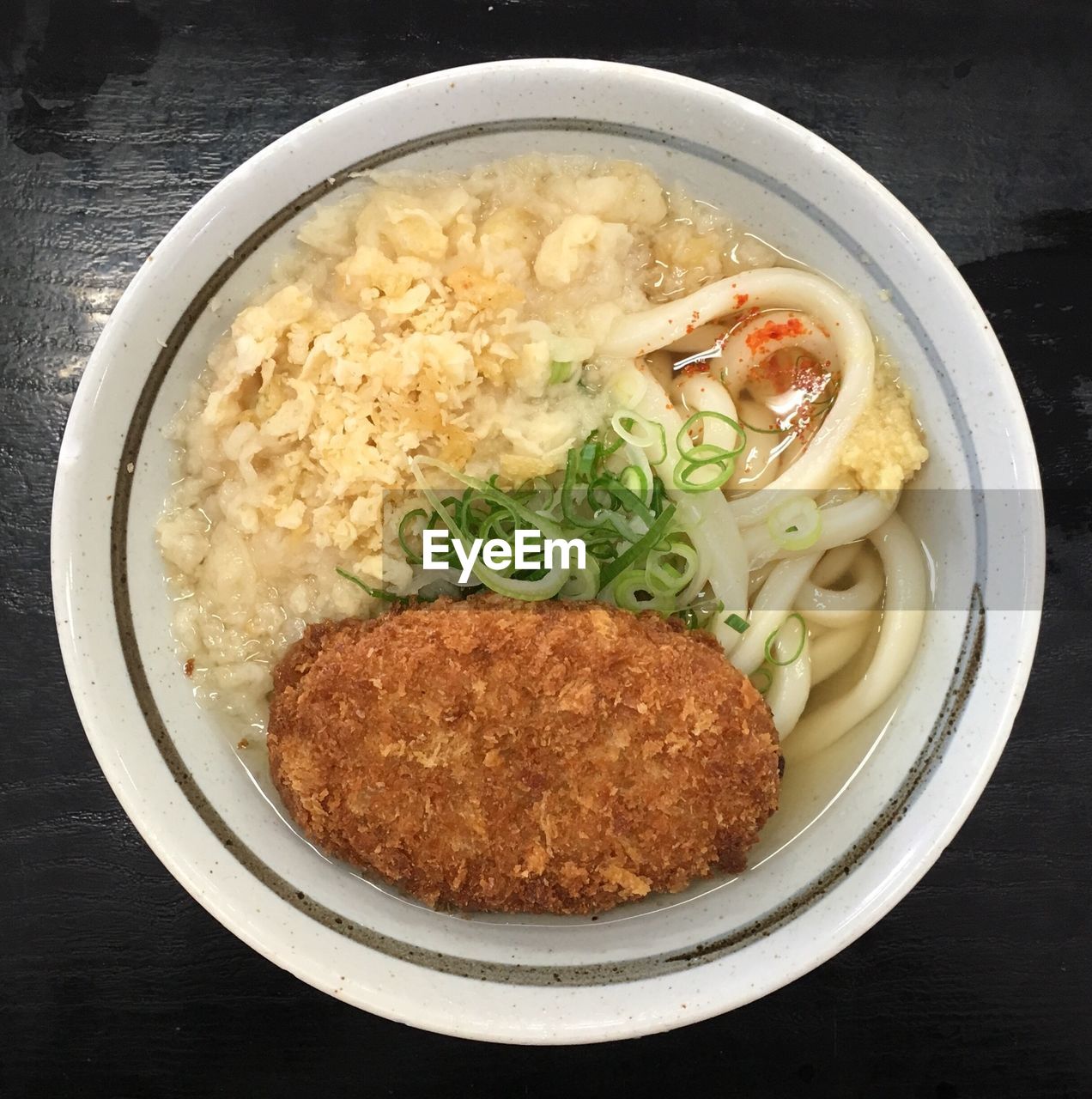 Close-up of udon noodles served on table