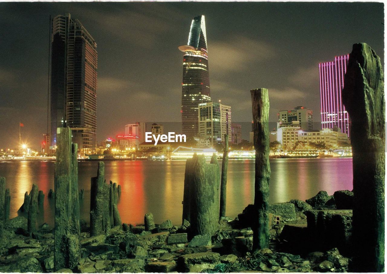 ILLUMINATED SKYSCRAPERS AT NIGHT