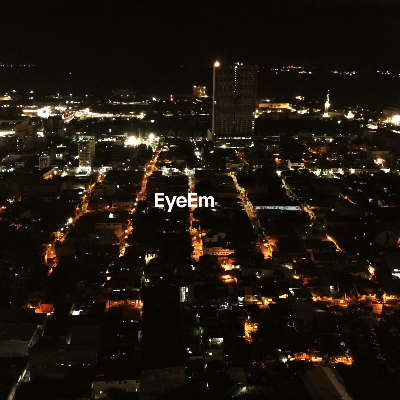 ILLUMINATED CITYSCAPE AT NIGHT