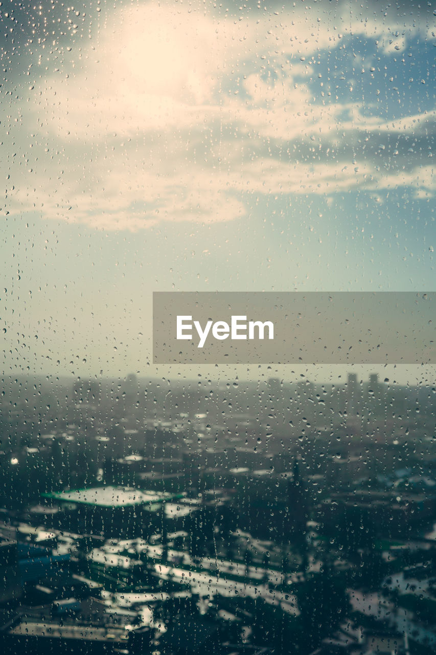 Cityscape seen through wet window