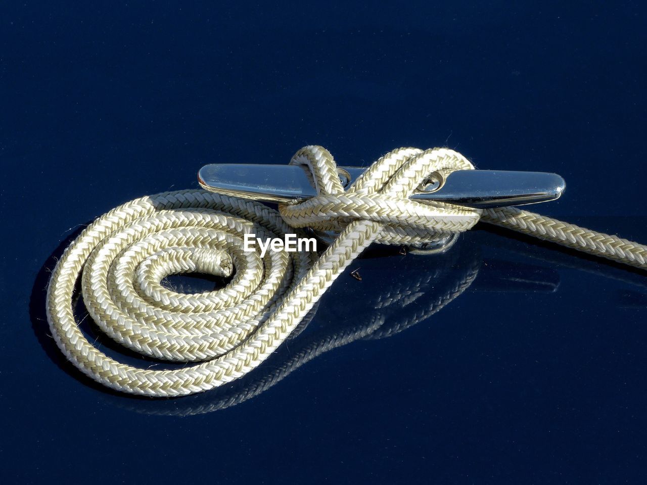 Close-up of rope against black background