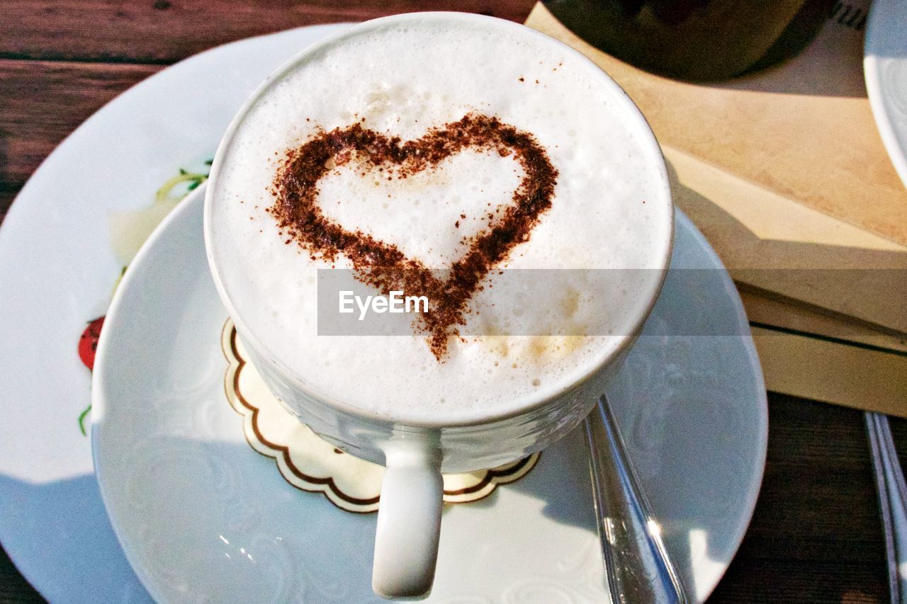 High angle view of coffee cup on table