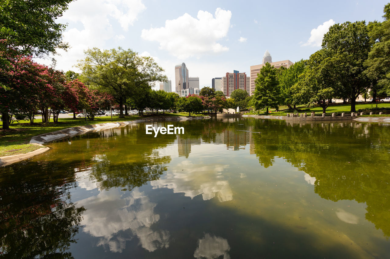 SCENIC VIEW OF LAKE BY TREES AGAINST SKY