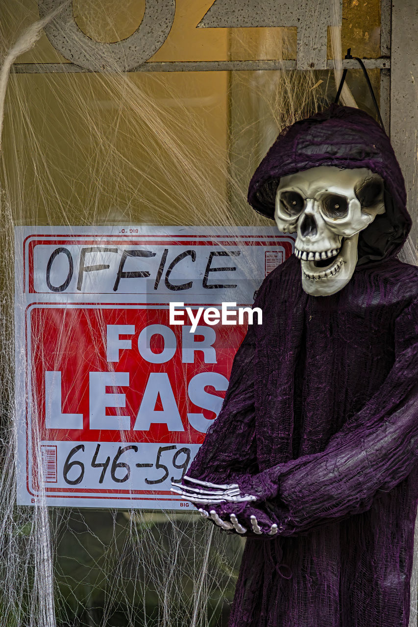 Halloween skeleton real estate agent