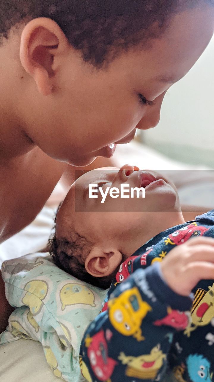 Close-up of boy with baby