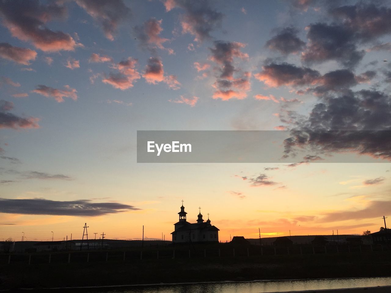 SILHOUETTE OF BUILDINGS AT SUNSET