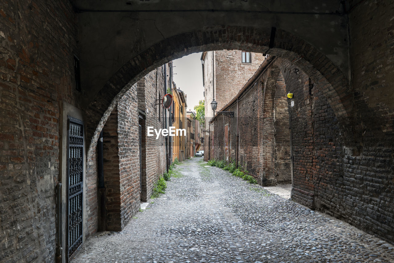 WALKWAY AMIDST BUILDINGS