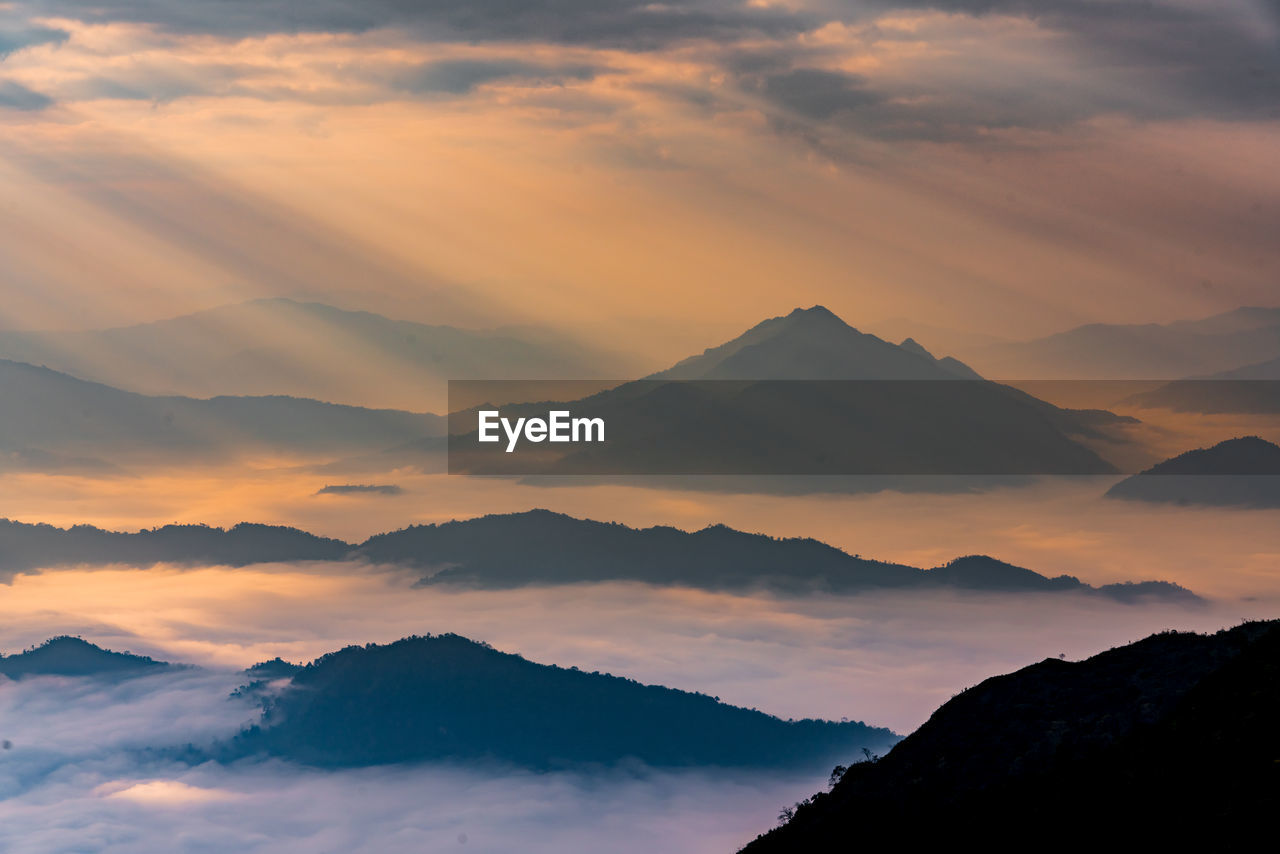 Scenic view of mountains against sky during sunset