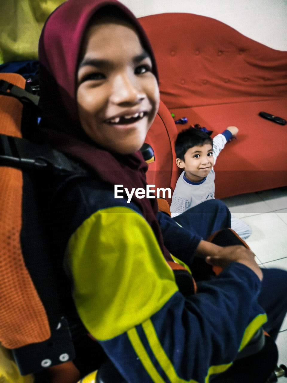 PORTRAIT OF SMILING BOY AND WOMAN