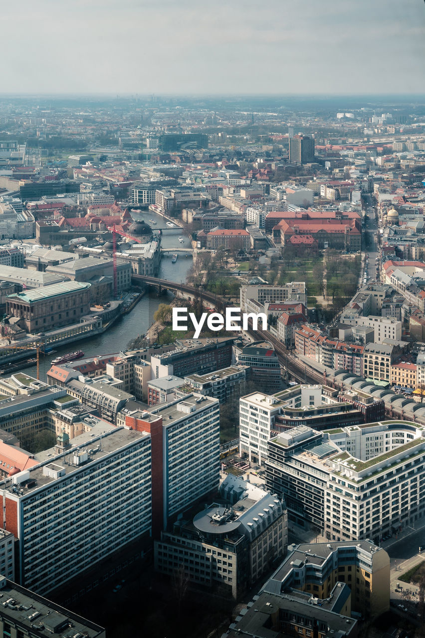 Aerial view of cityscape against sky