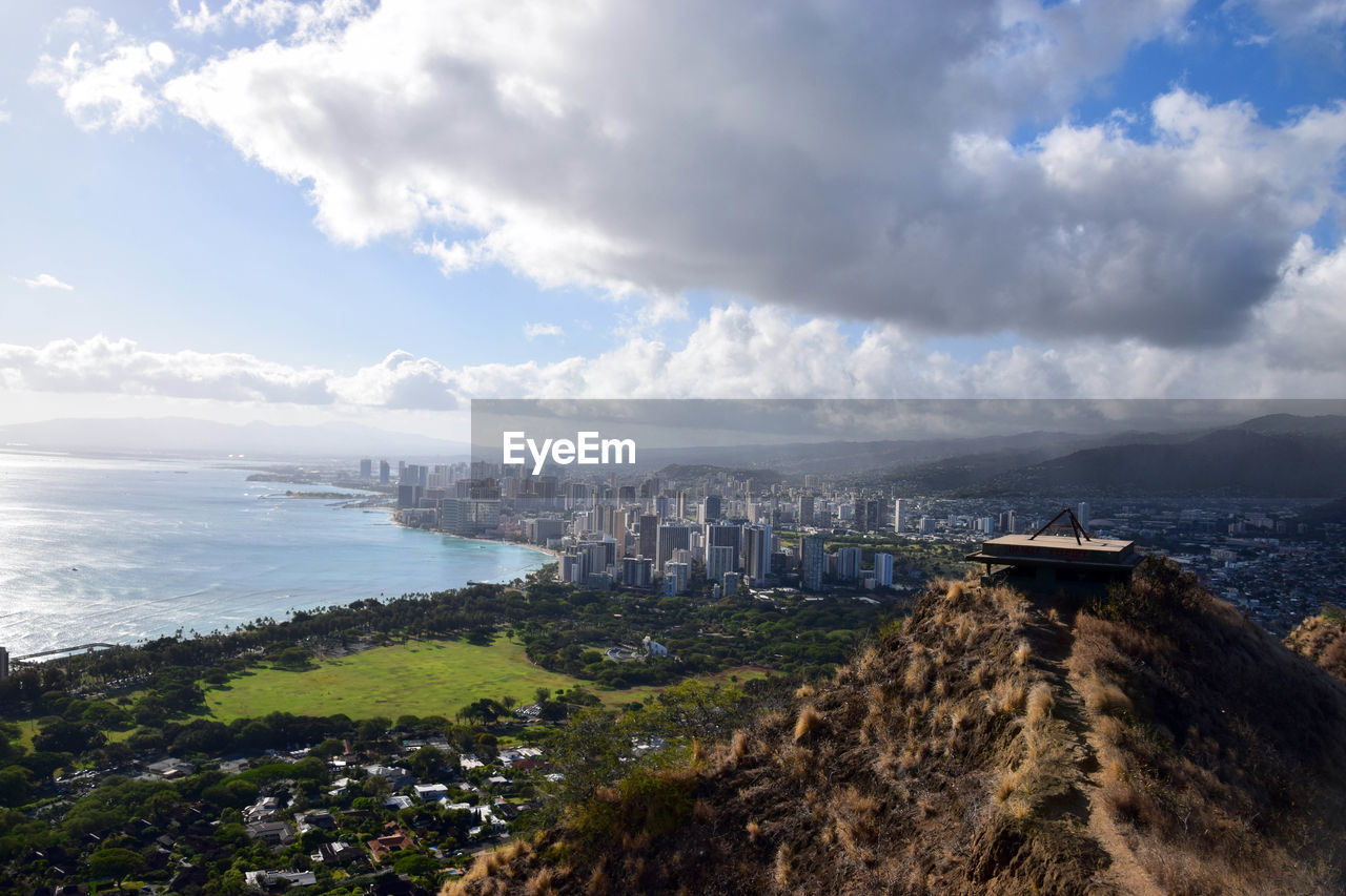 High angle view of buildings against calm sea