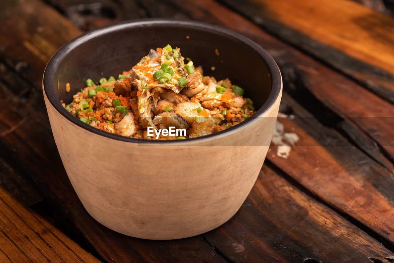 food and drink, food, healthy eating, wood, dish, wellbeing, vegetable, bowl, freshness, no people, cuisine, rustic, produce, meal, table, indoors, asian food, spice, meat, studio shot, stuffing, kitchen utensil, copy space, herb, rice - food staple, crockery