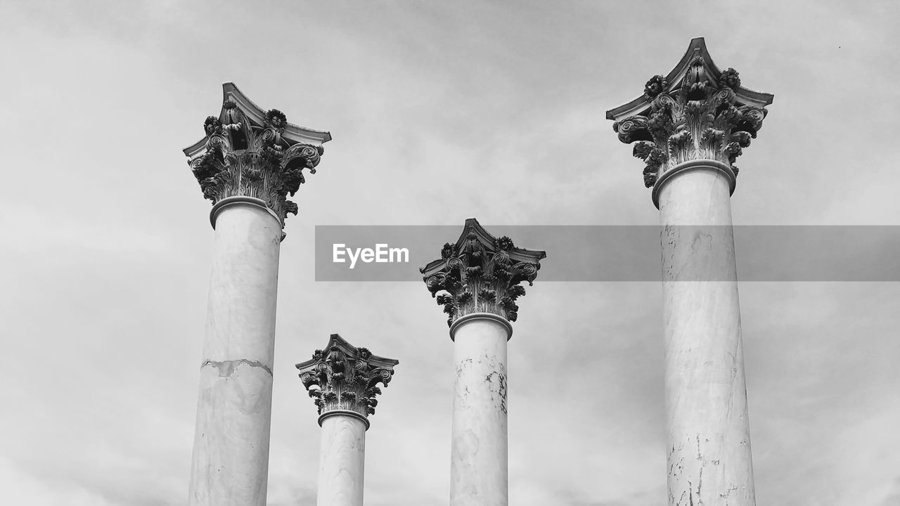 LOW ANGLE VIEW OF STATUE AGAINST THE SKY