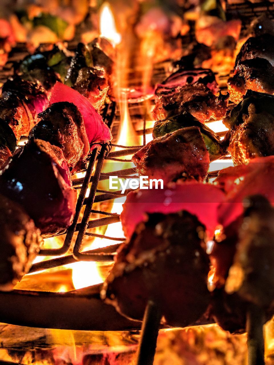 CLOSE-UP OF MEAT ON BARBECUE